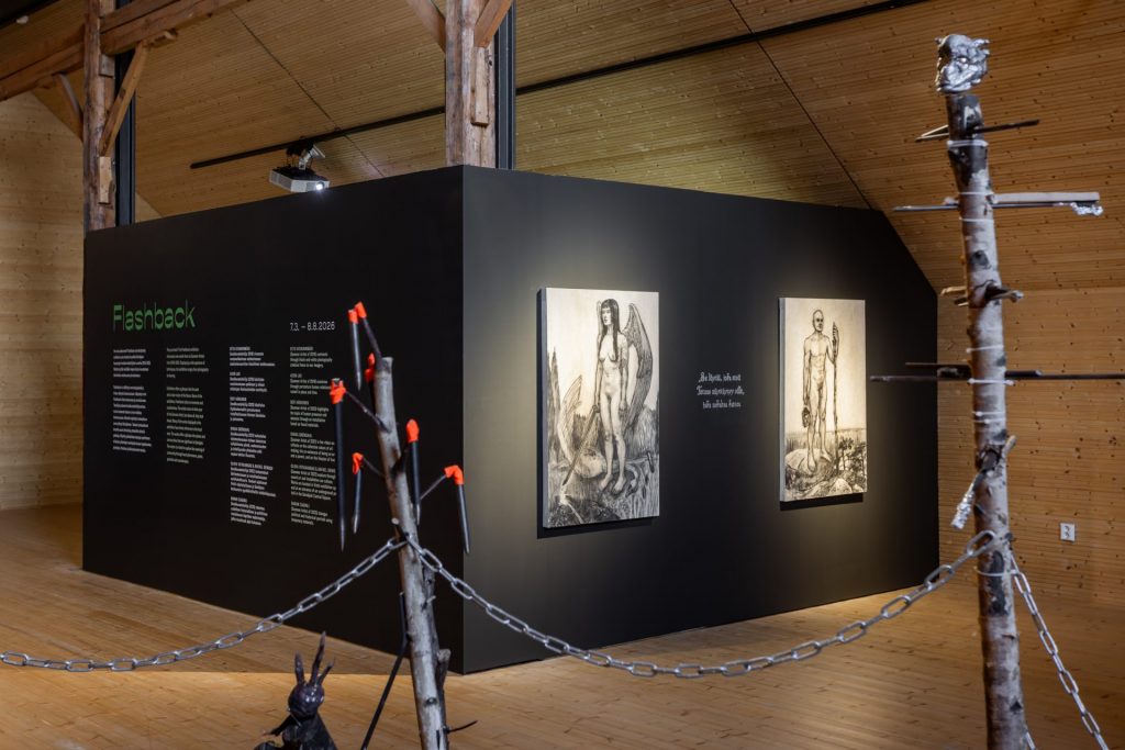 exhibition space that has wal whre is 2 paintings.