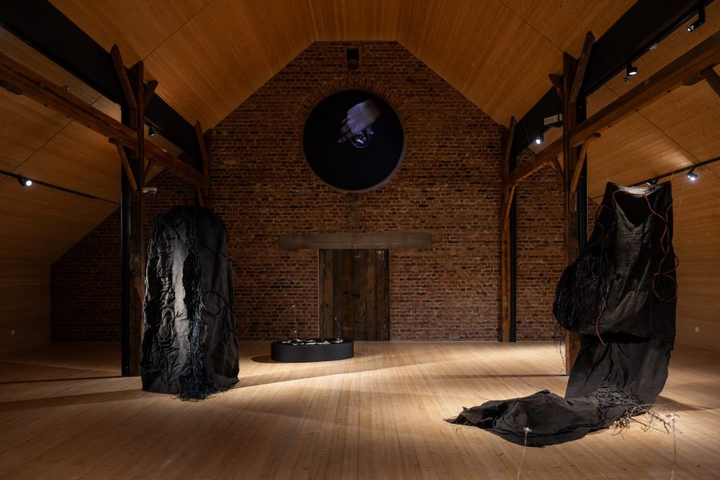 Exhibition view at an wooden attic looking exhibition space